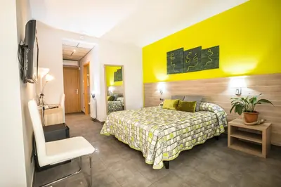 Cama o camas de una habitación en Hotel Victor