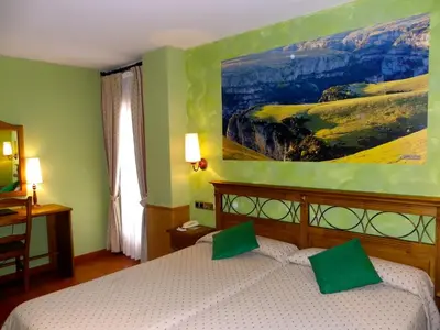 Cama o camas de una habitación en Hotel Arnal