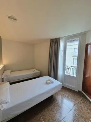 Cama o camas de una habitación en Hostal Rugaca