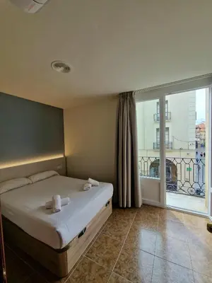 Cama o camas de una habitación en Hostal Rugaca