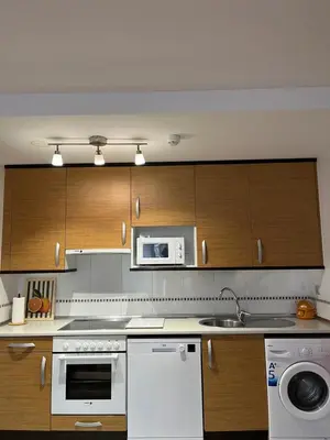 Una cocina o zona de cocina en Acogedor Apartamento En Huesca