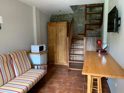 Una televisión o centro de entretenimiento en Hotel Charle