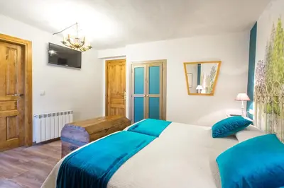 Cama o camas de una habitación en Hotel Villa San Jorge