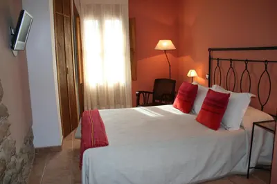 Cama o camas de una habitación en La Alquería