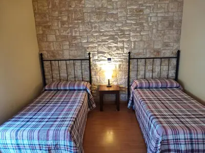 Cama o camas de una habitación en Hostal del Senglar