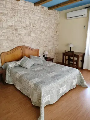 Cama o camas de una habitación en Hostal del Senglar