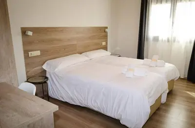 Cama o camas de una habitación en Hotel El Cobertizo