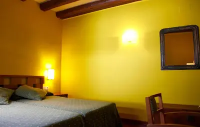 Cama o camas de una habitación en Hotel Vall Ferrera