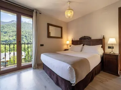 Cama o camas de una habitación en Villa de Plan Apartments&Suites
