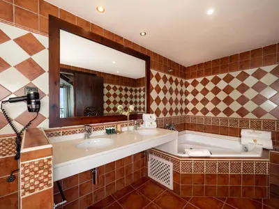 Un baño de Villa de Plan Apartments&Suites