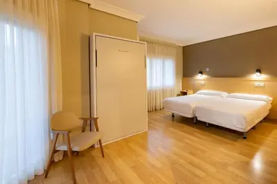 Cama o camas de una habitación en Hotel Santamaria