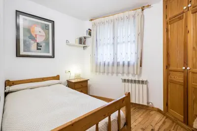 Cama o camas de una habitación en Apartamento La Benasquita