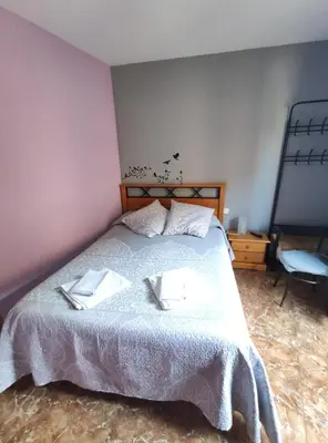Cama o camas de una habitación en Hostal El Bodegon