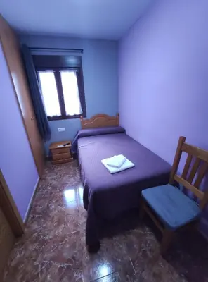 Cama o camas de una habitación en Hostal El Bodegon