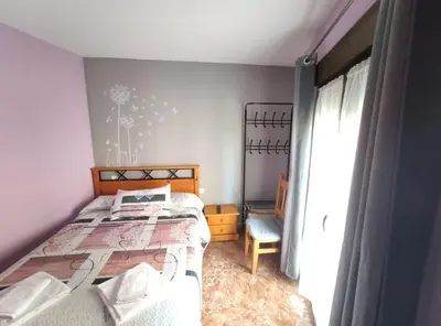 Cama o camas de una habitación en Hostal El Bodegon