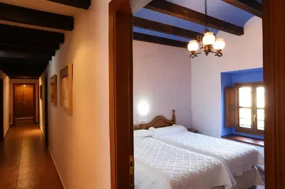 Cama o camas de una habitación en Hospedería Sádaba