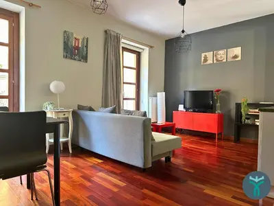 Una televisión o centro de entretenimiento en Dos Torres Retiro Urbano en Alfonso I