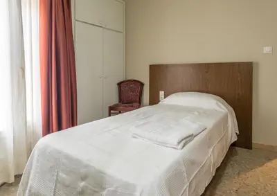 Cama o camas de una habitación en Hostal Sant Miquel
