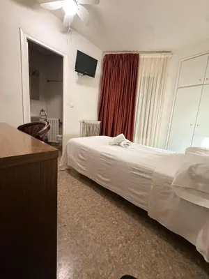 Cama o camas de una habitación en Hostal Sant Miquel