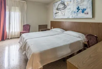 Cama o camas de una habitación en Hostal Sant Miquel