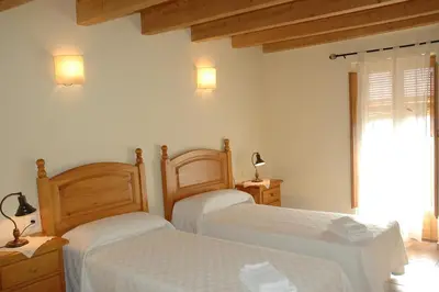 Cama o camas de una habitación en Casa con piscina y vistas a montaña - Cal Solsona
