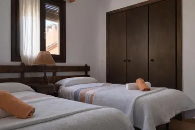 Cama o camas de una habitación en Casa amb llar de foc - Casa Anina