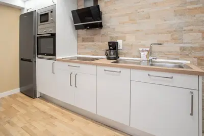 Una cocina o zona de cocina en Apartamentos La Jasa