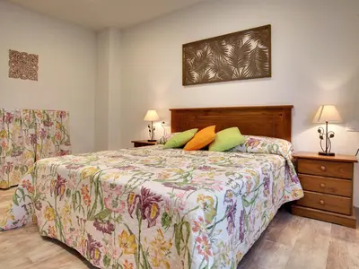 Cama o camas de una habitación en Apartamentos La Jasa
