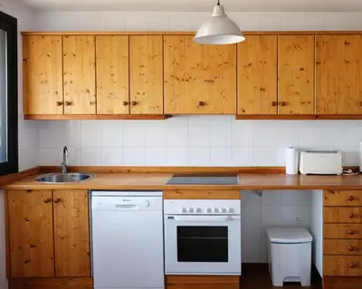 Una cocina o zona de cocina en Apartament amb llar de foc - Golfes Cal Gravat