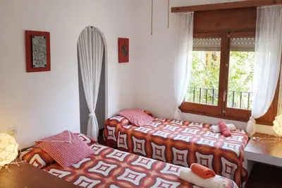 Cama o camas de una habitación en Casa rural amb cova - Cal Gravat