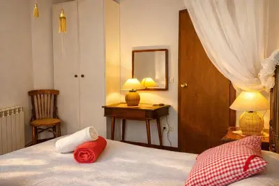 Cama o camas de una habitación en Casa rural amb cova - Cal Gravat