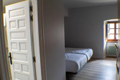 Cama o camas de una habitación en Posada de Roncesvalles