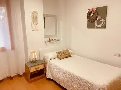 Cama o camas de una habitación en Apartamentos Alcañiz, Gala