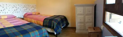 Cama o camas de una habitación en Albergue El Último Bucardo
