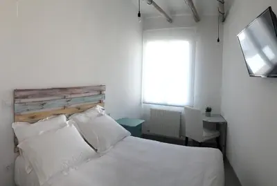 Cama o camas de una habitación en Hostal Gargal