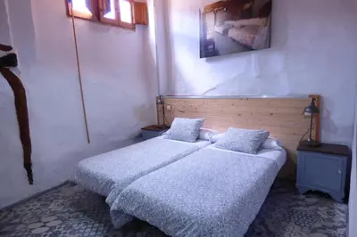 Cama o camas de una habitación en Casa Rural Muro de Aguas