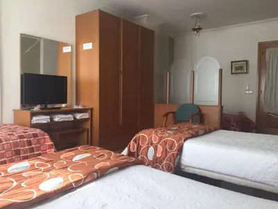 Cama o camas de una habitación en Pension Payvi