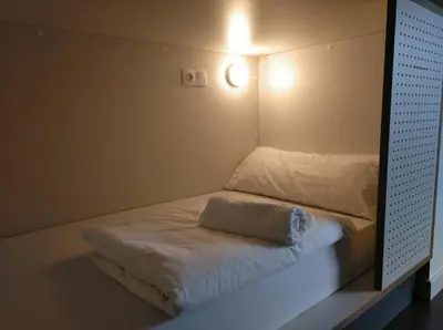 Cama o camas de una habitación en Agora Hostel