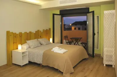 Cama o camas de una habitación en Alojamientos Dezerto Bardenas
