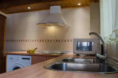 Una cocina o zona de cocina en Casa El Cuatro