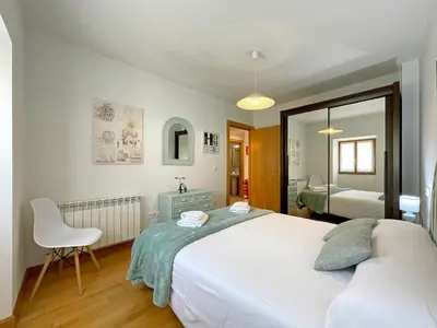Cama o camas de una habitación en Apartamentos Puente La Reina