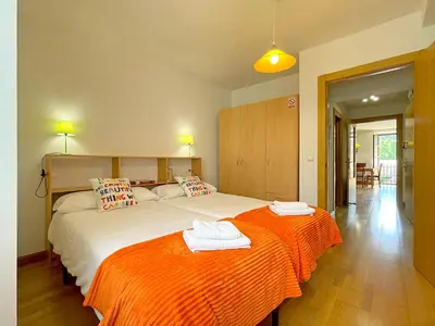 Cama o camas de una habitación en Apartamentos Puente La Reina
