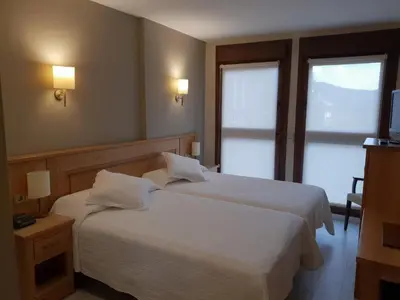 Cama o camas de una habitación en Hotel Alda A Boira