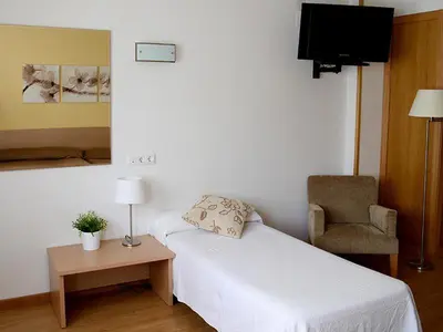 Cama o camas de una habitación en Hotel Mi Casa