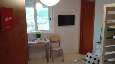 Una televisión o centro de entretenimiento en Apartaments Els Temporers