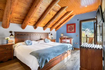 Cama o camas de una habitación en Hotel Rural El Mirador de los Pirineos