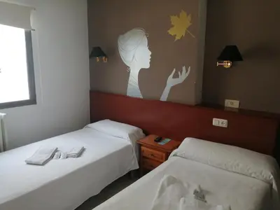 Cama o camas de una habitación en Hostal Jaime I