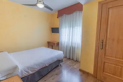 Cama o camas de una habitación en HOSTAL RIO ARA BELLOSTA by Vivere Stays