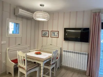 Una televisión o centro de entretenimiento en Apartamentos Casa Isabale