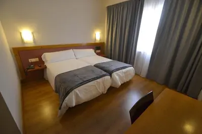 Cama o camas de una habitación en Hotel Brujas De Irues